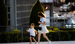 an image of a child and a woman running together